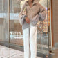 Trui van gebreid materiaal met uniforme glitter 