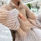 Trui van gebreid materiaal met uniforme glitter 