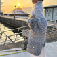 Trui van gebreid materiaal met uniforme glitter 